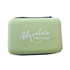 Green playing card case with 'Adventure Awaits' text on a white background