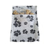 Reusable dog treat pouch with black paw print pattern, filled with biscuit treats and secure flap closure, perfect for training and travel Adventure Awaits