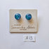 Pair of blue glass earrings on a branded card with 'Glass by Samantha Abbott Australia' text.