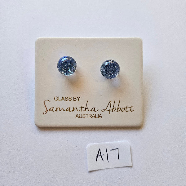 Pair of silver earrings on a branded card with 'Samantha Abbott' on a light background