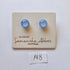 Pair of blue glass earrings on a branded card with 'Samantha Abbott' on a white background.