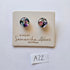 Pair of glass earrings on a branded card with 'Samantha Abbott' branding.
