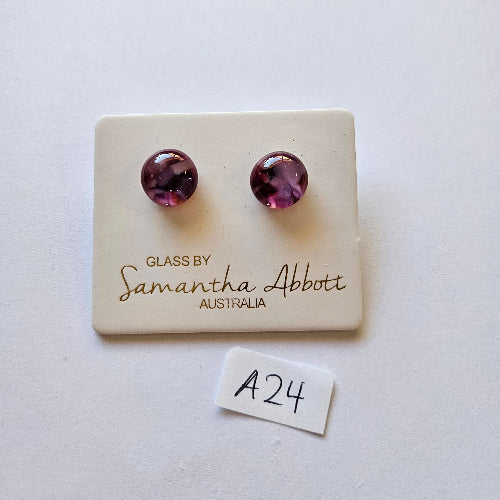 Pair of purple stud earrings on a branded card with 'Samantha Abbott' on a white background.