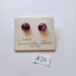 Pair of purple stud earrings on a branded card with 'Samantha Abbott' on a white background.