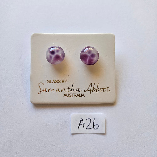 Pair of purple glass earrings on a branded card with 'Samantha Abbott' branding.