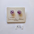 Pair of purple glass earrings on a branded card with 'Samantha Abbott' branding.