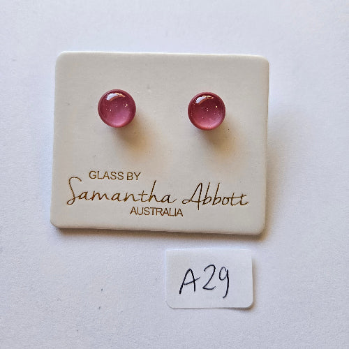 Pink glass beads on a branded card with 'Samantha Abbott' on a white background