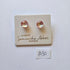 Pair of glass earrings on a branded card with 'Samantha Abbott' on a white background