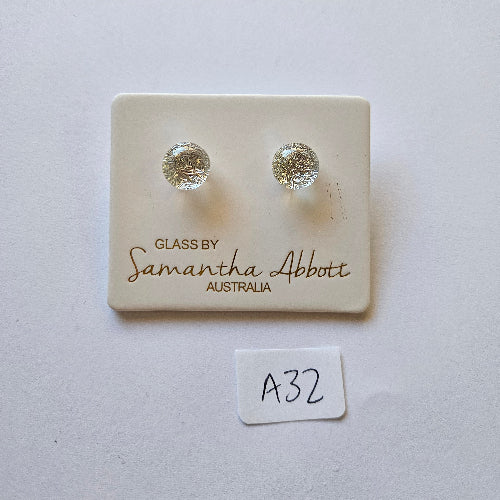 Pair of silver stud earrings on a branded card with 'Samantha Abbott' on a light gray background.