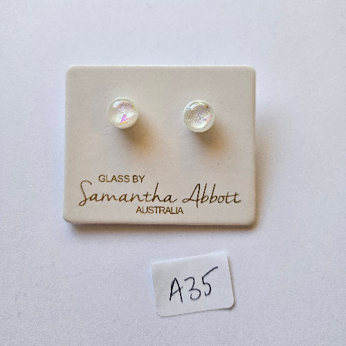 Pair of pearl earrings on a branded card with 'Samantha Abbott' branding.