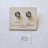 Samantha Abbott silver glass stud earrings displayed on white card in store