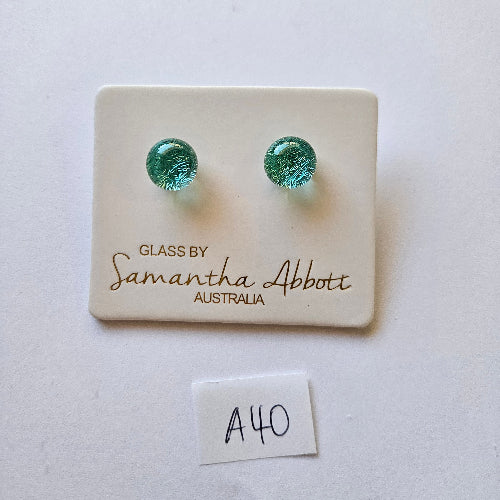 Green glass earrings on a branded card with 'Samantha Abbott' on a white background