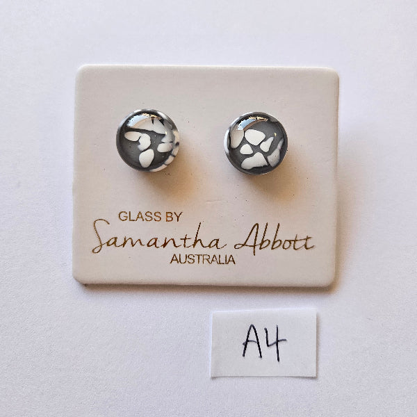 Pair of black and white patterned earrings on a branded card with 'Samantha Abbott Australia' text.