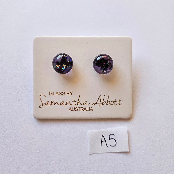 Pair of purple glass earrings on a branded card with 'Samantha Abbott' branding.