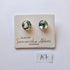 Pair of glass earrings on a branded card with 'Samantha Abbott' branding.