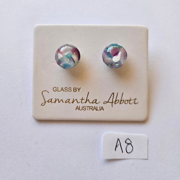 Pair of glass earrings on a branded card with 'Samantha Abbott' on a white background.