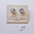 Pair of glass earrings on a branded card with 'Samantha Abbott' on a white background.