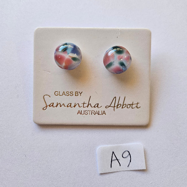 Pair of floral glass earrings on a branded card with 'Glass by Samantha Abbott' text.