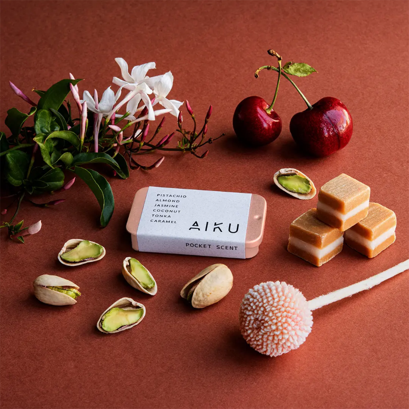 AIKU tin of solid perfume in Pistachio Affair with cherry, pistachio, caramel and floral fragrance notes — Adventure Awaits