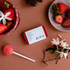 AIKU tin of solid perfume in Rosella with strawberries, jasmine flowers and a pink lollipop — Adventure Awaits