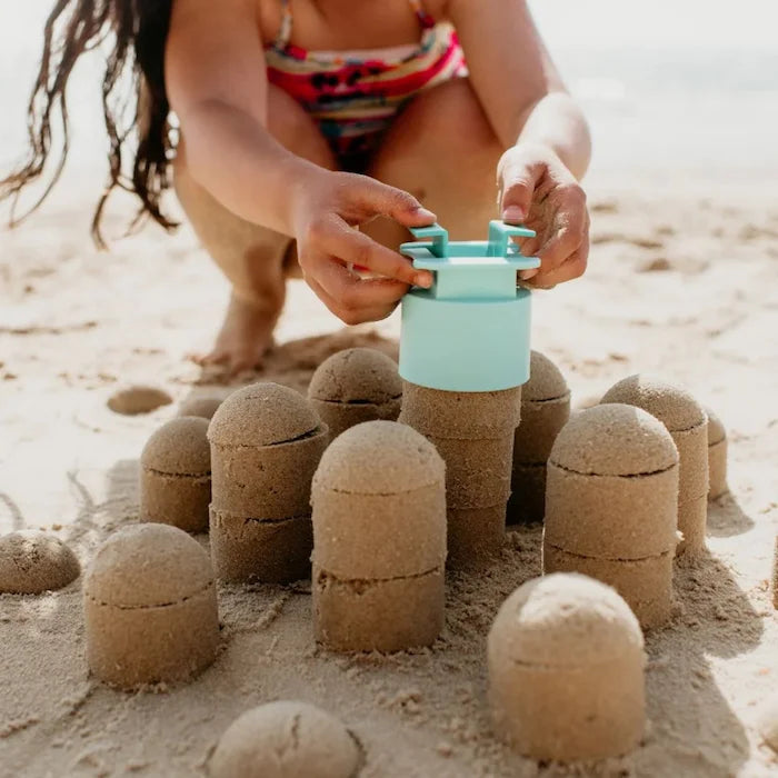 Little girl playing with Sand Pal sand castle building toys  - Adventure Awaits
