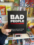 Bad People party game box held in store, black pack for adults game night Adventure Awaits