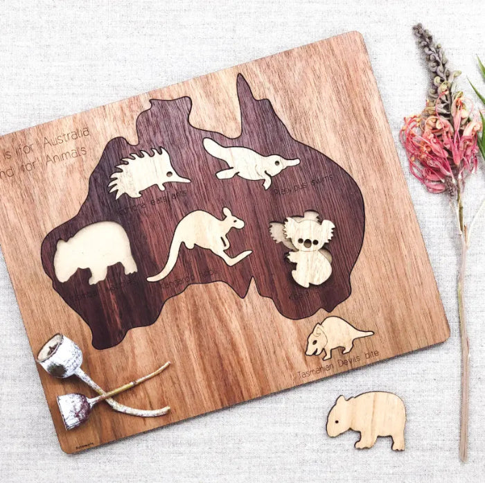 Australian map timber puzzle with removable native animal pieces including koala and kangaroo — Adventure Awaits