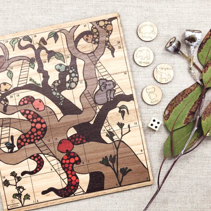 Australian timber snakes and ladders game with native animal pieces and wooden dice — Adventure Awaits