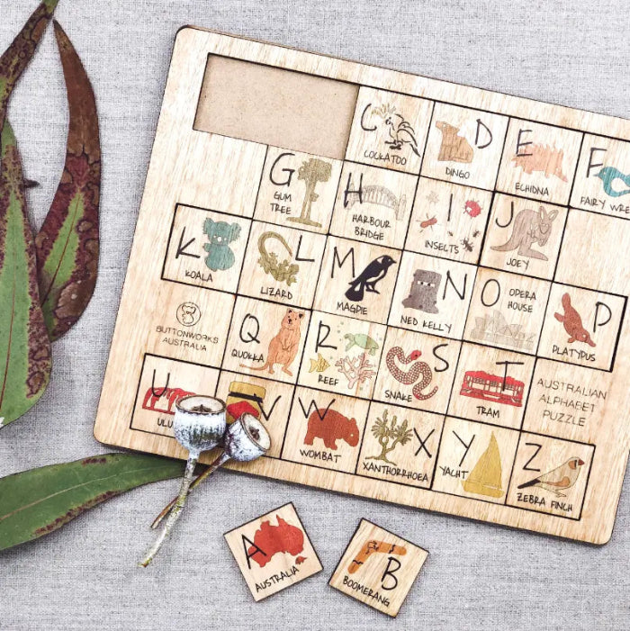 Australian alphabet timber puzzle with removable letter tiles, native animals and landmarks — Adventure Awaits