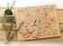 Australian alphabet timber puzzle with removable letter tiles, native animals and landmarks on a wooden table — Adventure Awaits