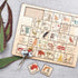 Australian alphabet timber puzzle with removable letter tiles, native animals and landmarks — Adventure Awaits