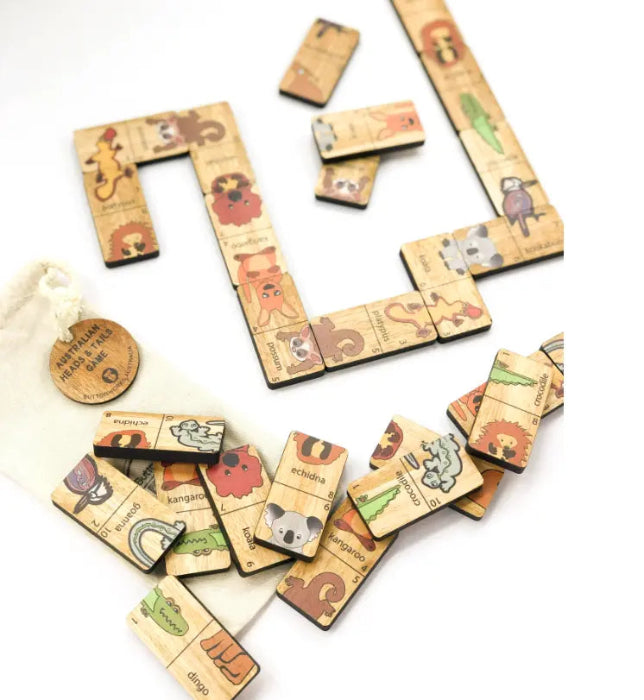 Australian Heads & Tails timber game with native animal pieces arranged for play beside the cotton bag — Adventure Awaits