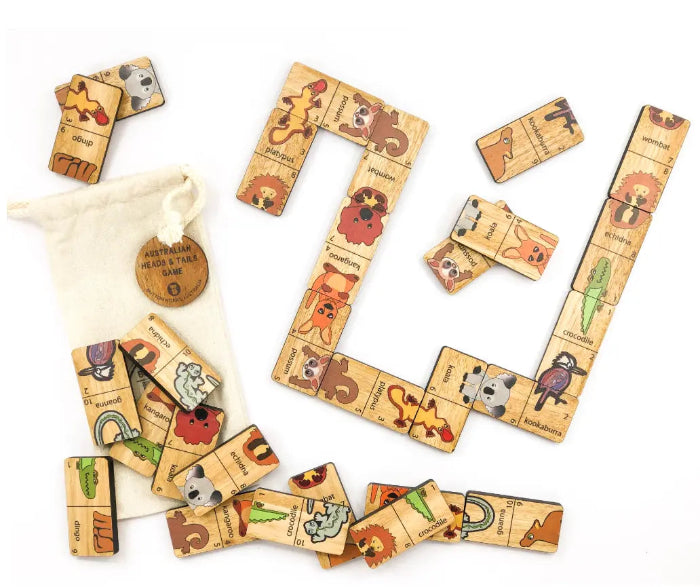 Australian Heads & Tails timber game with native animal pieces arranged for play beside the cotton bag — Adventure Awaits