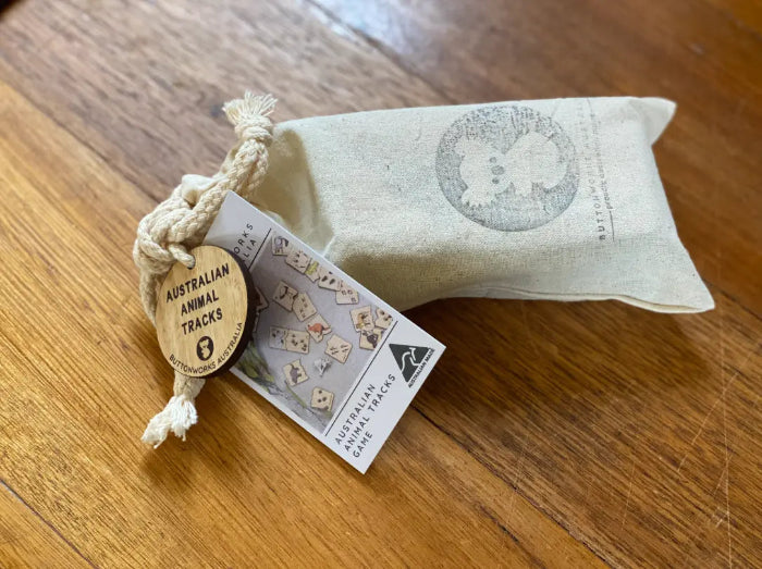 Australian animal tracks timber game packed in a cotton drawstring bag with product tag — Adventure Awaits
