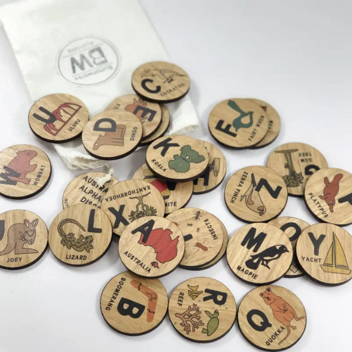 Australian alphabet timber discs with native animals, landmarks and cotton drawstring bag — Adventure Awaits