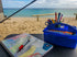 Kids travel Journal in front of beach 