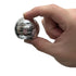 Silver gyroscope fidget shown pinched between thumb and forefinger against white background