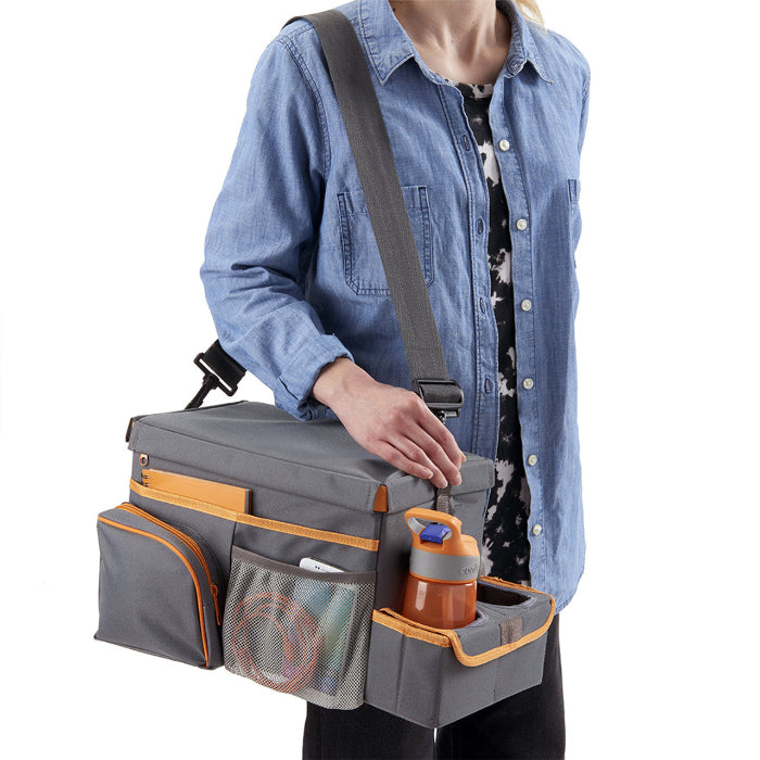 Adventure Awaits High Road CarHop seat cooler and organiser carried over the shoulder with bottle holder tray extended