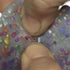 Close-up of hands interacting and picking gems out of a colourful gelatinous surface