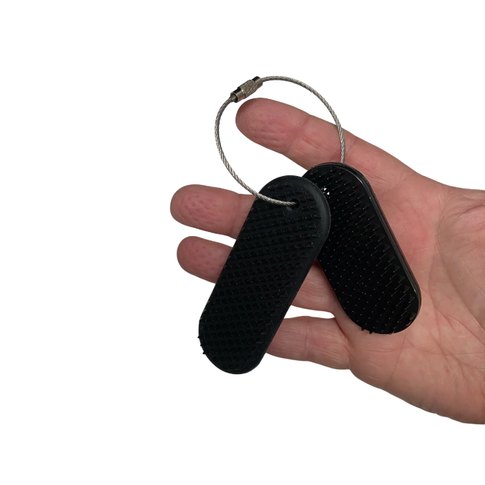 kaiko spikeyring in black on hand with indents shown on fingers