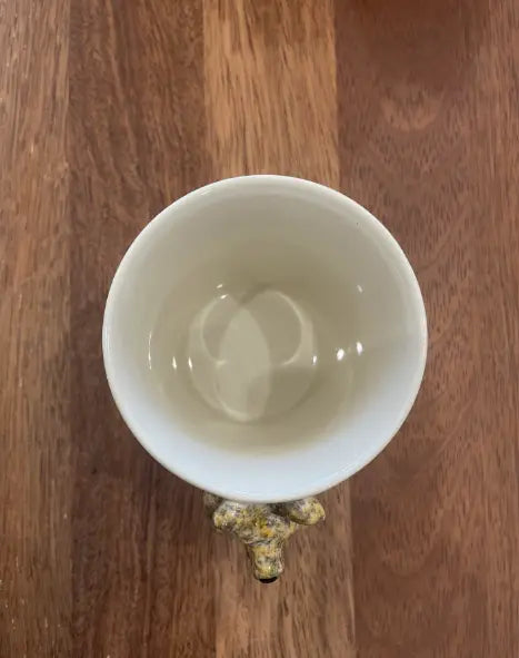 Top view of cream kangaroo mug showing the sculpted kangaroo handle below — Adventure Awaits