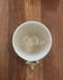 Top view of cream kangaroo mug showing the sculpted kangaroo handle below — Adventure Awaits