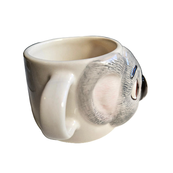White ceramic koala mug with a textured design on a white background