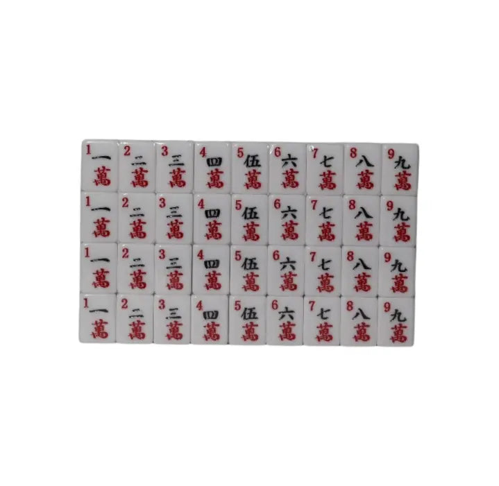 Travel Mahjong character suit tiles laid out for compact road trip game — Adventure Awaits