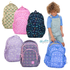 Five colorful backpacks with different patterns and a child holding a blue backpack.