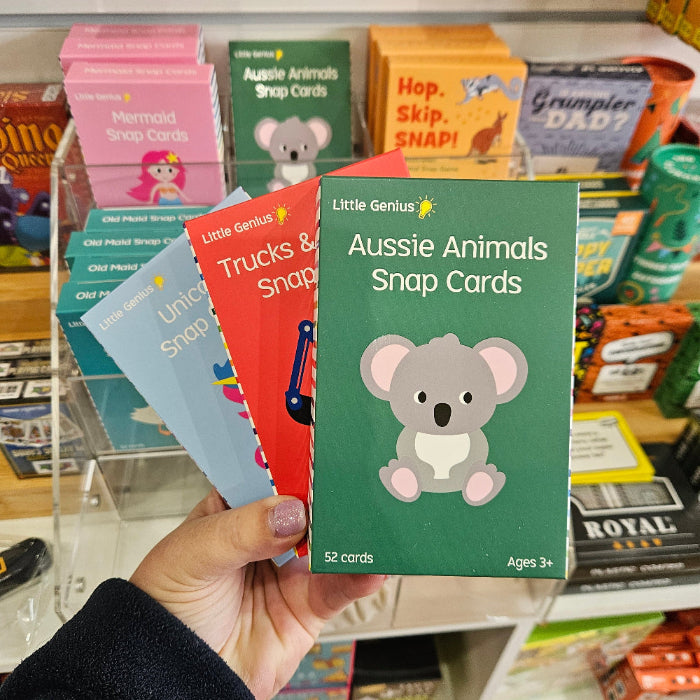 Adventure Awaits Little Genius snap card games displayed in store, including Aussie Animals, Unicorn and Trucks themes
