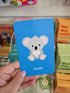 Adventure Awaits Little Genius Aussie Animals snap card featuring a koala illustration on a blue playing card