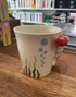 Cream lobster handle mug with seaweed and bubble details on a wooden counter — Adventure Awaits