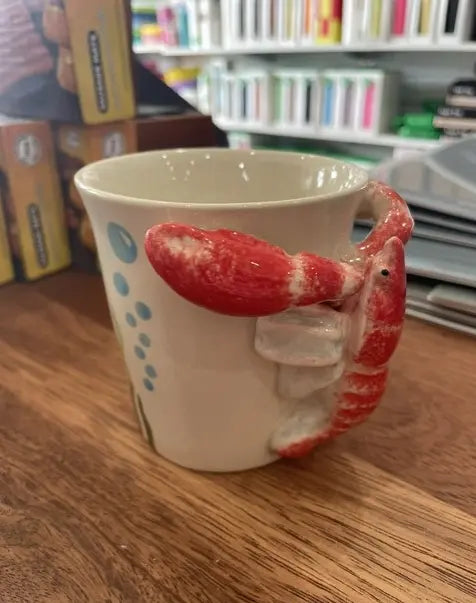 Cream lobster handle mug with raised red 3D lobster and blue bubble details — Adventure Awaits