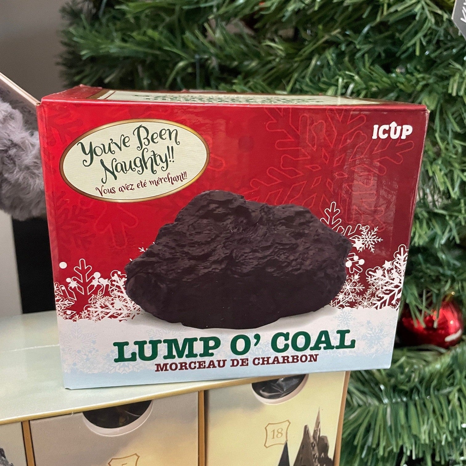 Toy lump of coal in box